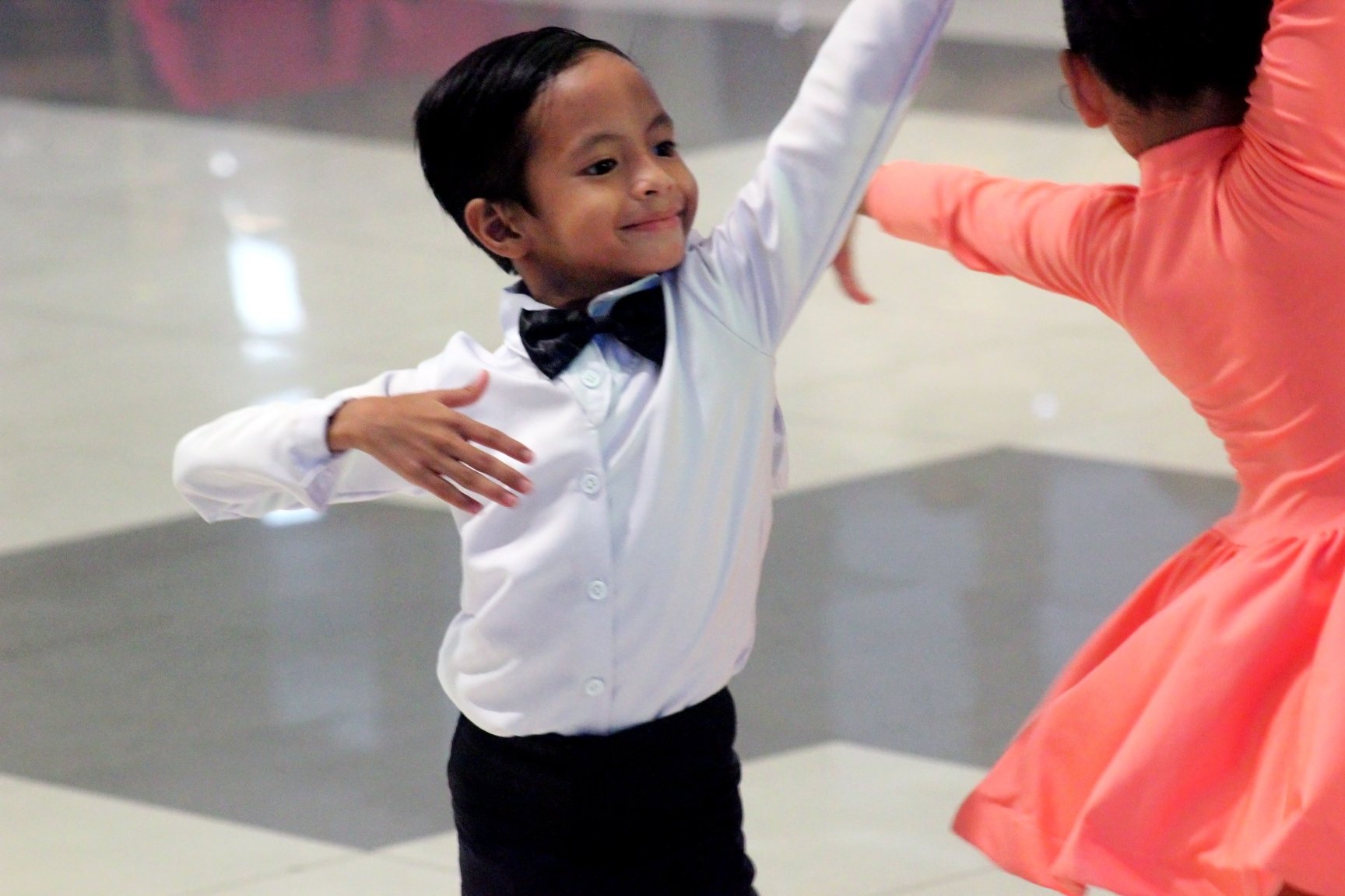 A child competing for DanceSport.